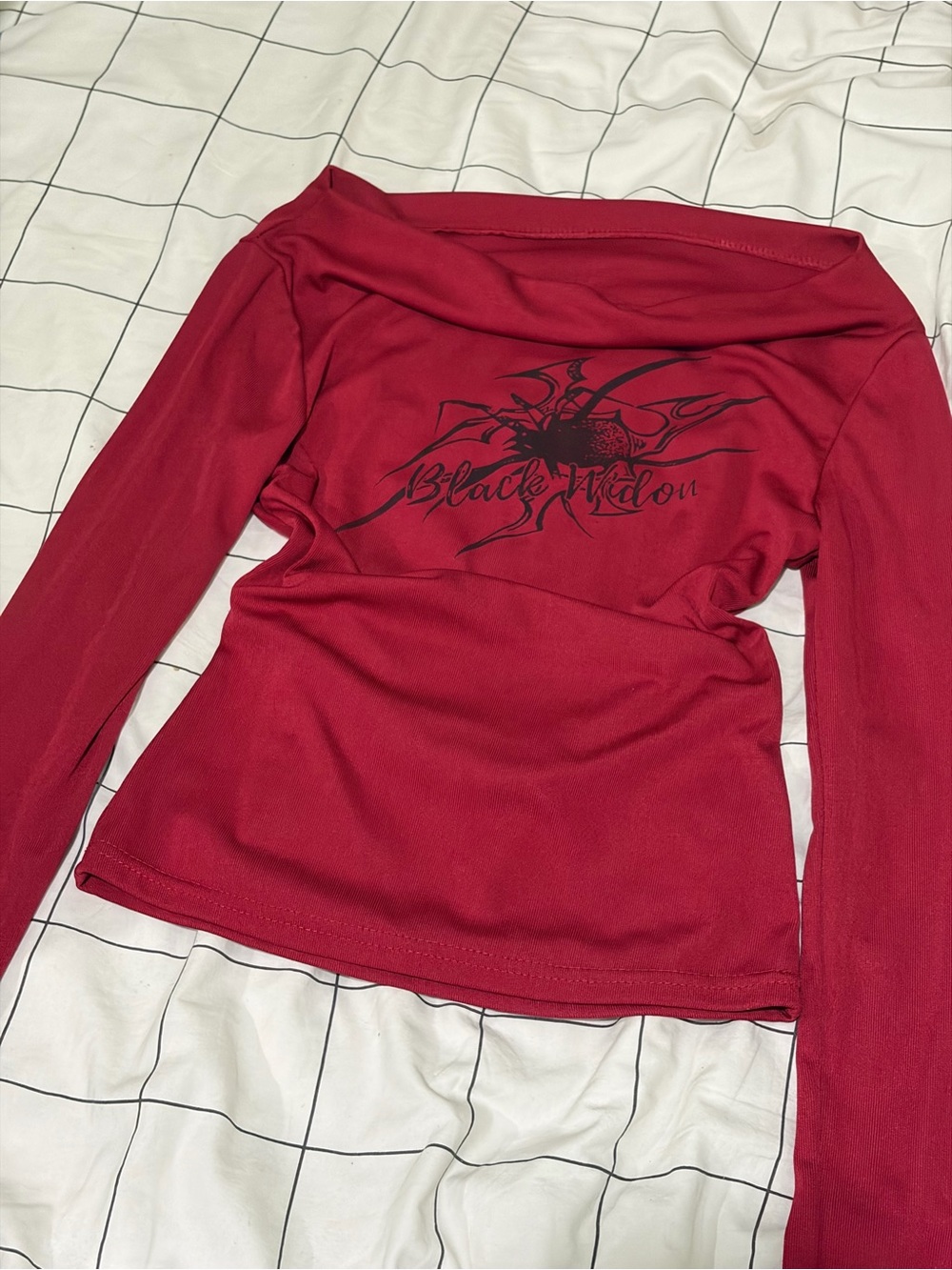 off the shoulder red y2k long sleeve with black spider graphic